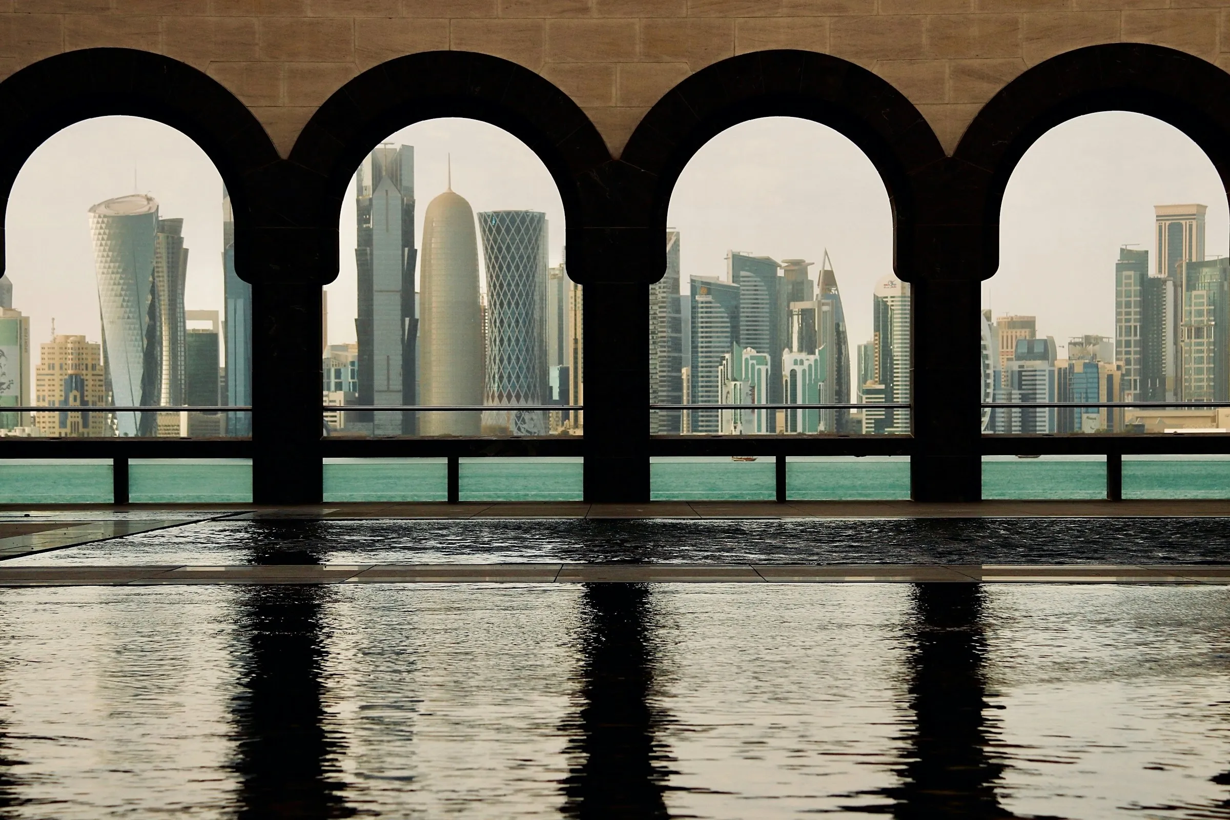 Doha skyline reflected in a pool of water